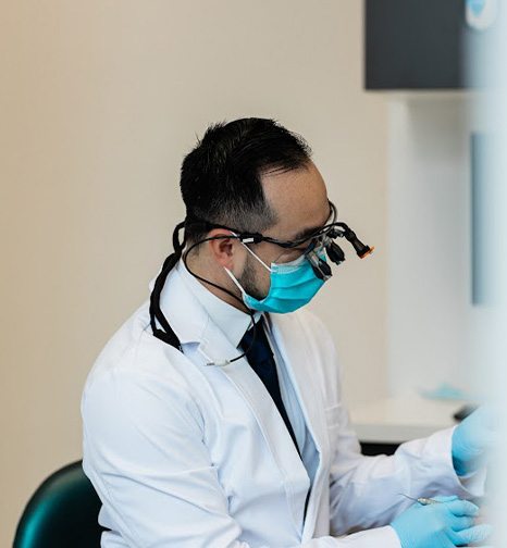 Dentist showing a patient x rays of their teeth