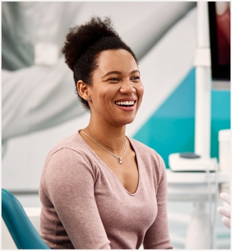 Woman grinning in dental chair