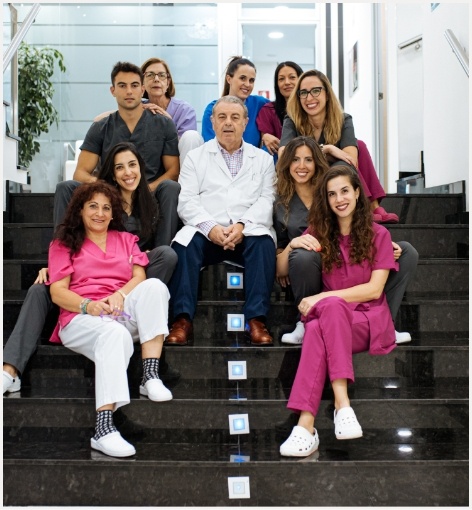 Hayward California dental team sitting on some stairs