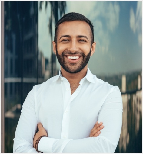 Man in white collared shirt smiling after preventive dentistry in Hayward