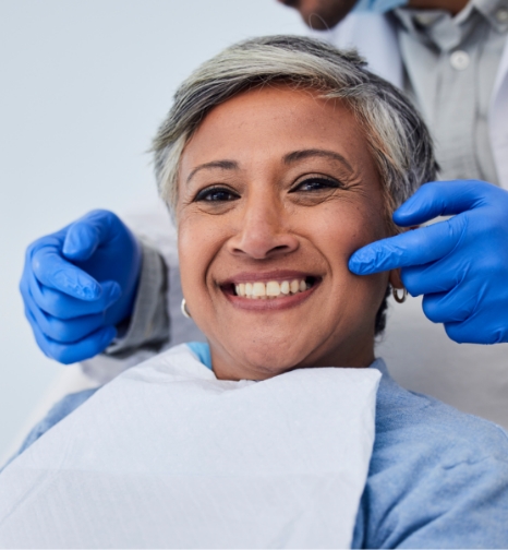 Woman smiling in dental chair during dental checkup