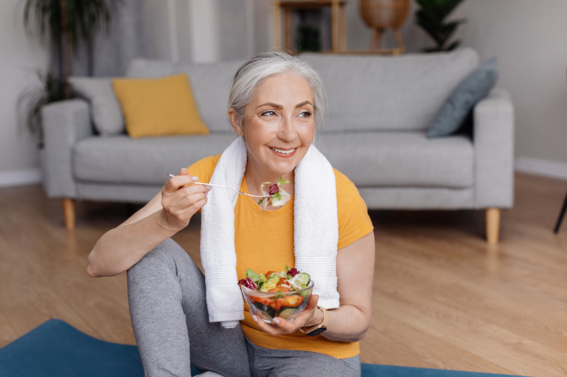 Patient eating healthy after dental implant surgery